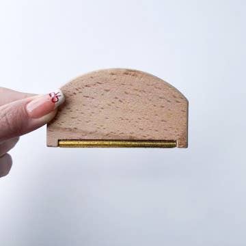 Eco-Friendly Wooden Lint Remover: Compact